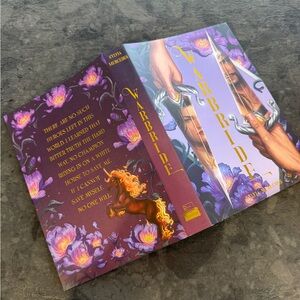 The bookish box Warbride Book with Purple and Gold Cover